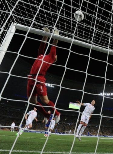 English goalkeeper Joe Hart jumps for the ball during the Euro 2012 football championships match England vs Ukraine at the Donbass Arena in Donetsk. England scraped into the quarter-finals of Euro 2012 here Tuesday after a goal-line refereeing blunder helped them to a 1-0 win over Ukraine which sent the co-hosts crashing out