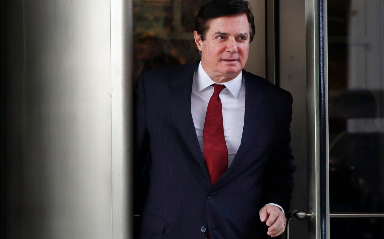 Paul Manafort, Donald Trump's former campaign manager, leaves a courthouse in Washington in November - AP