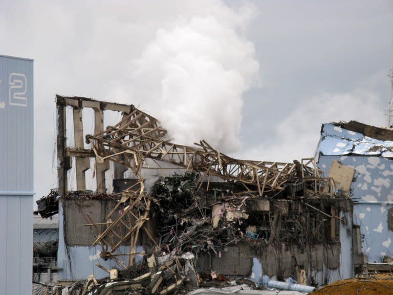 A Tepco picture taken on March 15, 2011 shows white smoke rising from the unit 3 reactor building at Fukushima. Two-and-a-half years into what could be a four-decade clean-up, the nuclear disaster sparked by an earthquake and tsunami is very much the Achilles heel of Tokyo's efforts to bag the Games