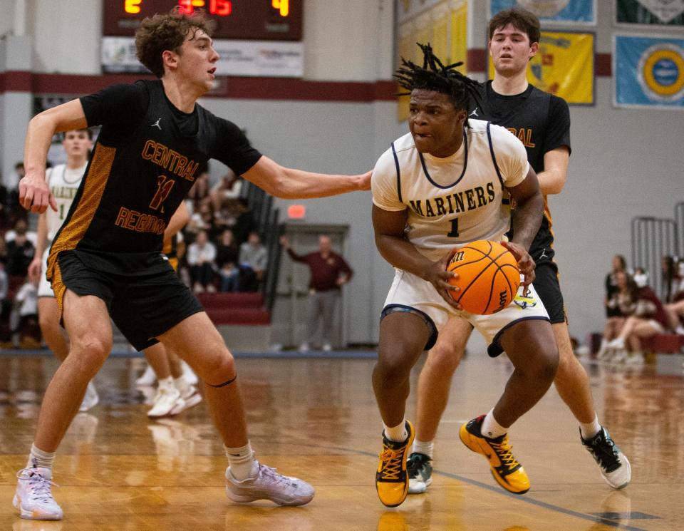 Toms River North's Micah Ford works against several Central defenders during a game on Jan. 12, 2024, in Berkeley Township, NJ.