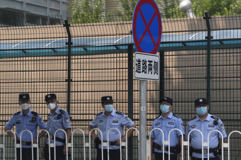 Chinese policemen stand on duty outside the United States Embassy in Beijing, Wednesday, Aug. 3, 2022. U.S. House Speaker Nancy Pelosi arrived in Taiwan late Tuesday, becoming the highest-ranking American official in 25 years to visit the self-ruled island claimed by China, which quickly announced that it would conduct military maneuvers in retaliation for her presence. (AP Photo/Ng Han Guan)