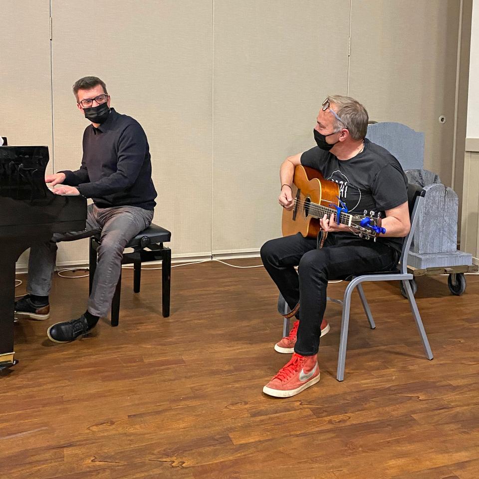 Composer Marcus Hummon on guitar, and music director/conductor Steve Kummer at the piano rehearse for the world premiere of Hummon’s opera “Favorite Son.”