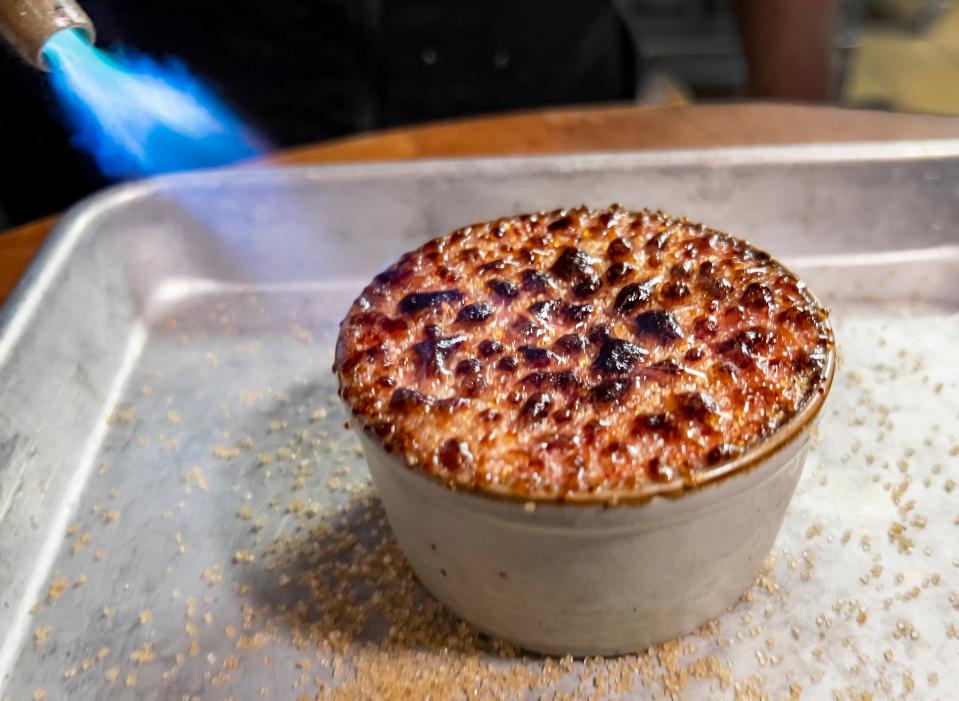 An Indian-spiced chicken liver pâté gets brûléed at Stage Kitchen and Bar in Palm Beach Gardens.