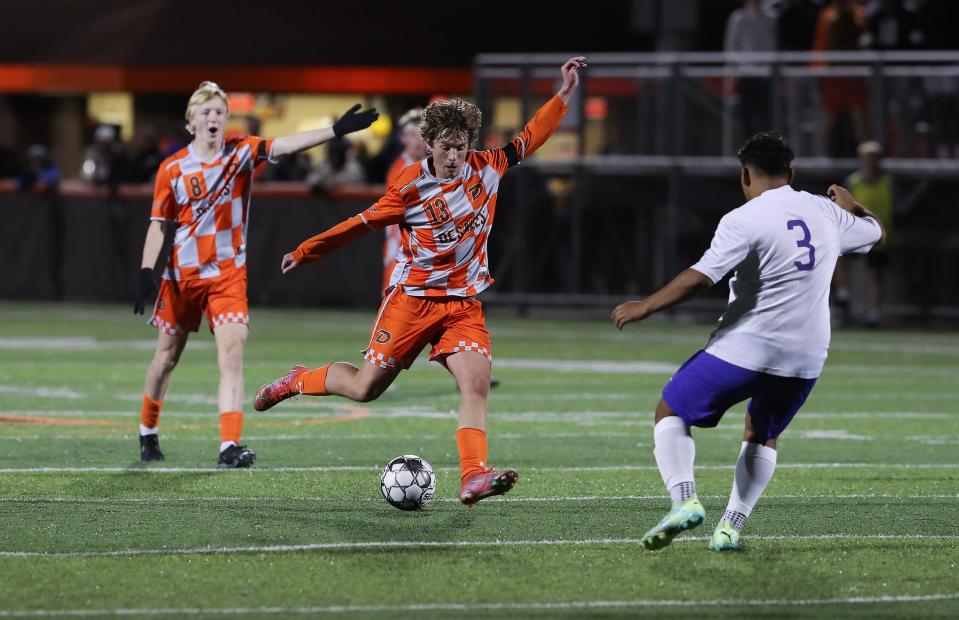 DeSales' Tyler Droege moves the ball upfield against Bardstown during the first round of the state soccer tournament Monday night.