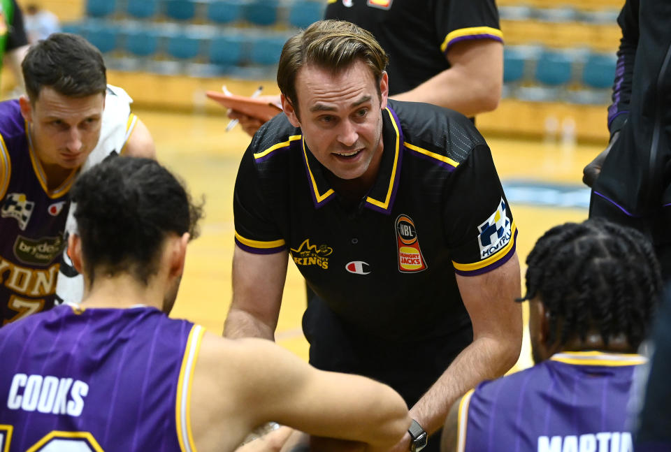 Sydney Kings coach Chase Buford talks to his players.