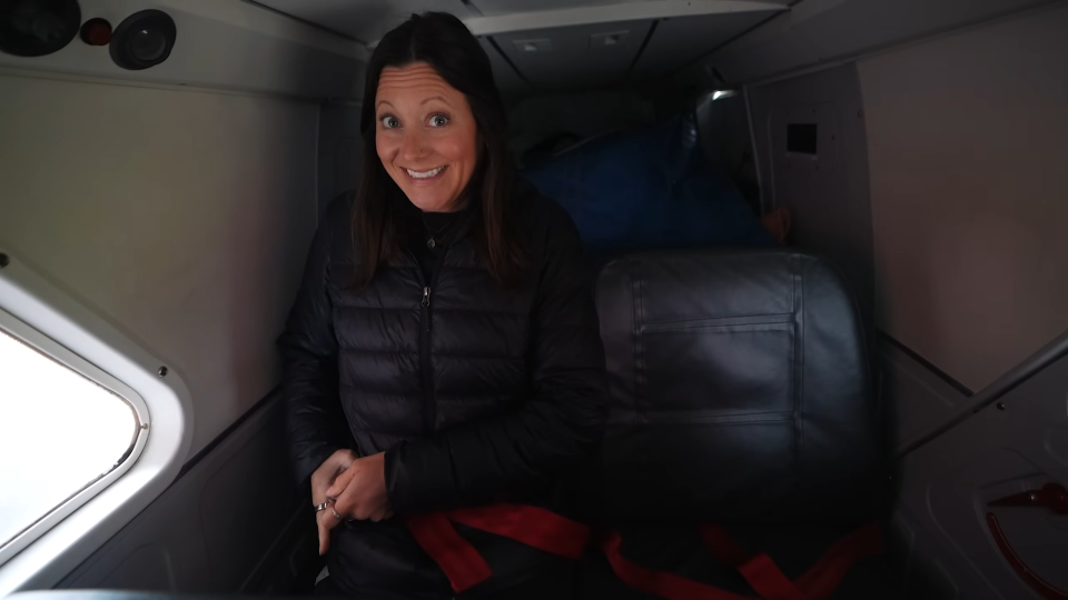 A woman inside a small airplane