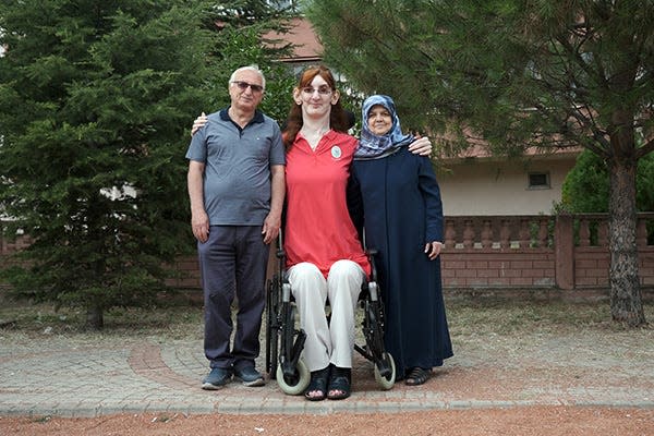 Turkey’s Rumeysa Gelgi poses with her parents.