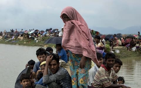 Displaced Rohingya refugees from Rakhine state in Myanmar rest near Ukhia, near the border between Bangladesh and Myanmar, as they flee violence on September 4, 2017 - Credit:  AFP