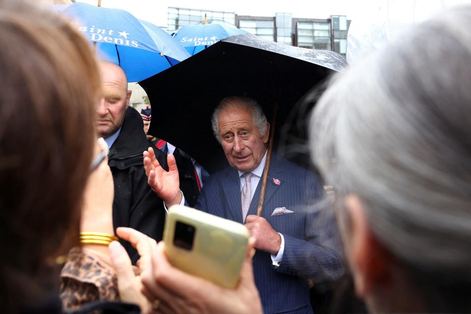 King Charles greets the crowds at the flower market (PA)