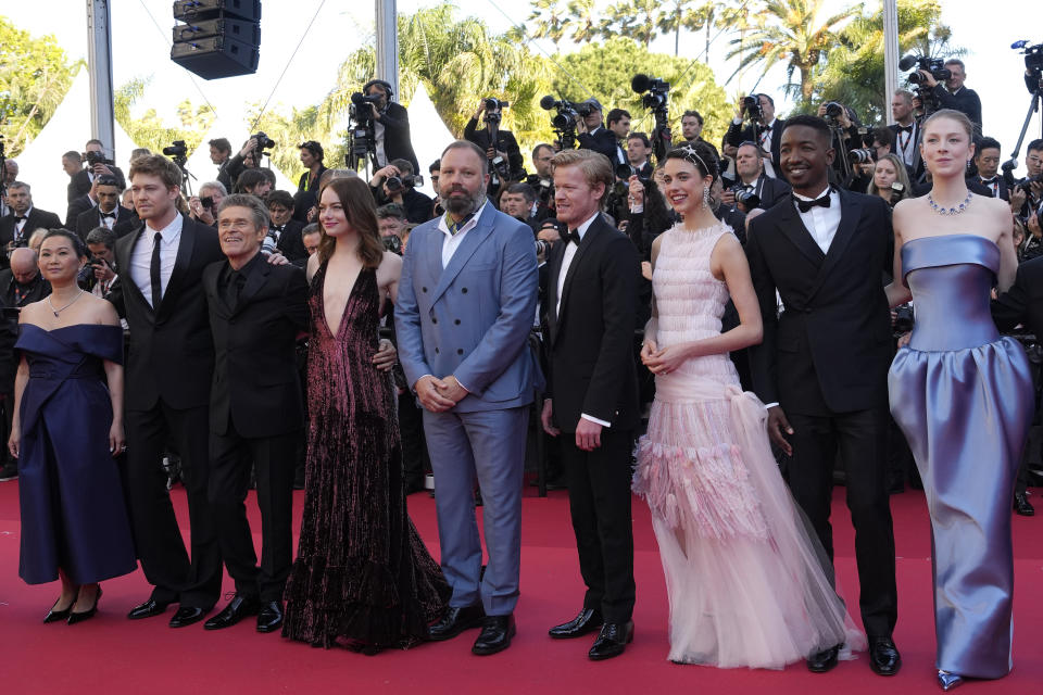 Hong Chau, from left, Joe Alwyn, Willem Dafoe, Emma Stone, director Yorgos Lanthimos, Jesse Plemons, Margaret Qualley, Mamoudou Athie, and Hunter Schafer pose for photographers upon arrival at the premiere of the film 'Kinds of Kindness' at the 77th international film festival, Cannes, southern France, Friday, May 17, 2024. (Photo by Andreea Alexandru/Invision/AP)