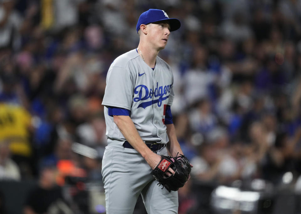 Los Angeles Dodgers starting pitcher Ryan Yarbrough reacts after giving up a two-run home run to Colorado Rockies' Elehuris Montero during the third inning of a baseball game Thursday, Sept. 28, 2023, in Denver. (AP Photo/David Zalubowski)