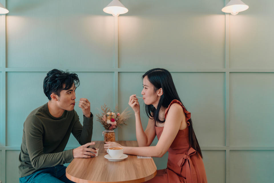 Singaporean couple on date eating ice cream 