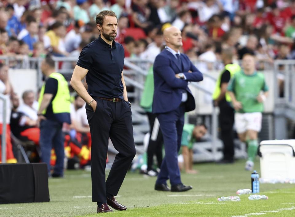 Gareth Southgate’s (left) players were jeered for taking the knee before the match (Trenka Attila/PA) (PA Wire)