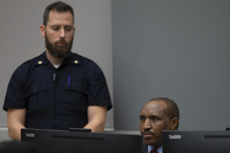 Congolese militia commander Bosco Ntaganda enters the courtroom of the International Criminal Court, or ICC, to hear the sentence in his trial in The Hague, Netherlands, Thursday, Nov. 7, 2019. The ICC delivered the sentence on Ntaganda, accused of overseeing the slaughter of civilians by his soldiers in the Democratic Republic of Congo in 2002 and 2003. (AP Photo/Peter Dejong, Pool)