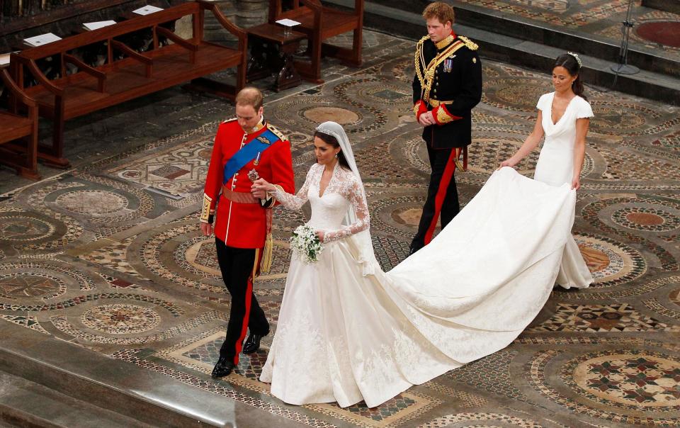 Prince William and Duchess Kate of Cambridge, during their wedding at Westminster Abbey on April 29, 2011. His brother Prince Harry and her sister, Pippa Middleton, accompany them after the service.