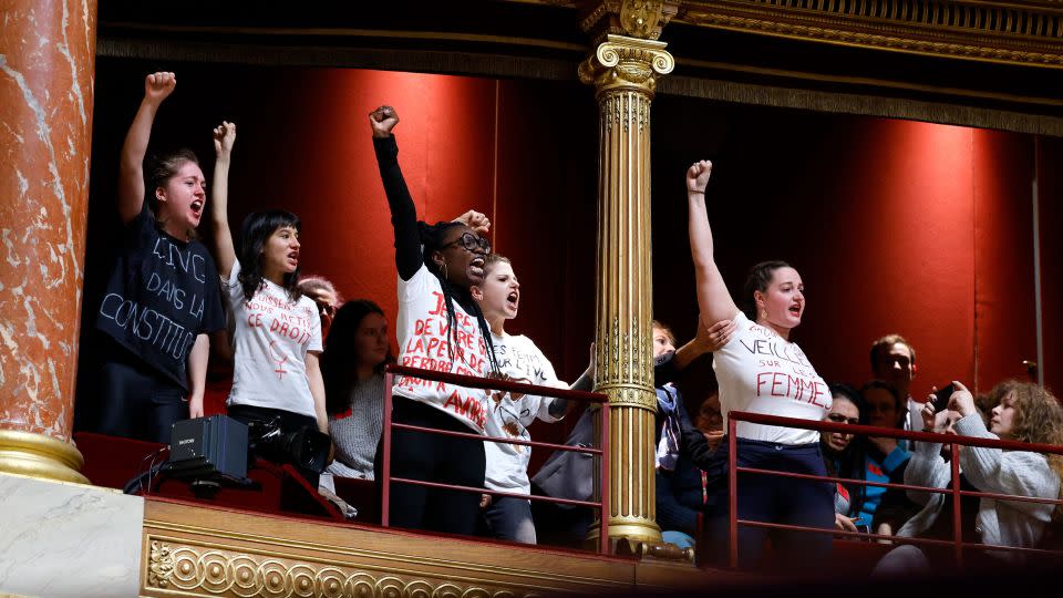 Protesters voice their support for abortion rights during a debate at the Senate in Paris. - Ludovic Marin/AFP/Getty Images