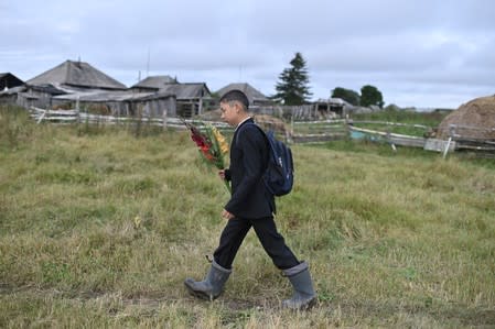 The Wider Image: Russian village's last teacher stays on for her one remaining pupil