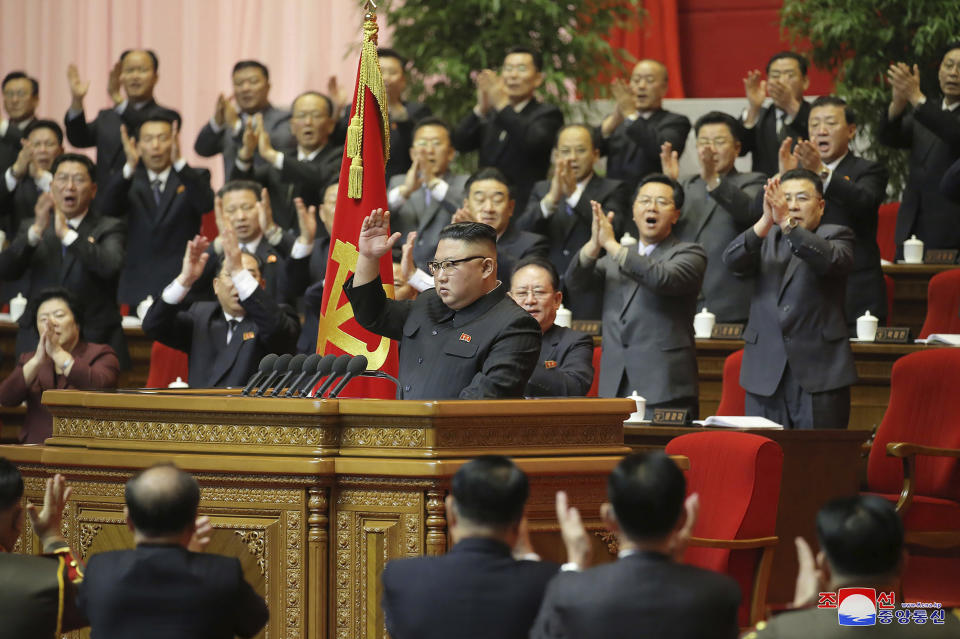 In this photo provided by the North Korean government, North Korean leader Kim Jong Un, center, acknowledges to the applauds after he made his closing remarks at a ruling party congress in Pyongyang, North Korea Tuesday, Jan. 12, 2021. Kim vowed all-out efforts to bolster his country's nuclear deterrent during the major ruling party meeting where he earlier laid out plans to work toward salvaging the broken economy. Independent journalists were not given access to cover the event depicted in this image distributed by the North Korean government. The content of this image is as provided and cannot be independently verified. Korean language watermark on image as provided by source reads: "KCNA" which is the abbreviation for Korean Central News Agency. (Korean Central News Agency/Korea News Service via AP)