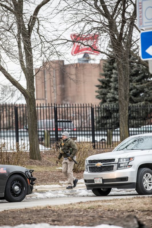 Police investigate a shooting at the Molson Coors headquarters in Milwaukee, Wisconsin