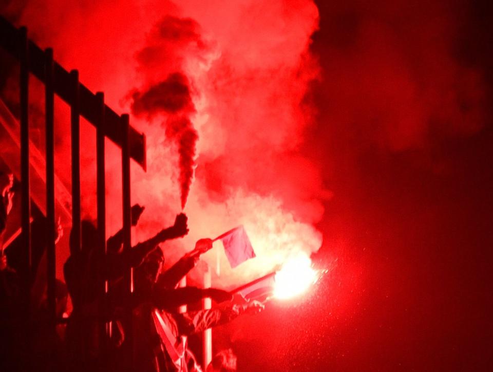 People light flares at an anti-far-right concert&nbsp;in Chemnitz in eastern Germany in September. As anti-immigrant populism has gained in the country, so has the Green Party, which unapologetically supports more open immigration laws. (Photo: JOHN MACDOUGALL via Getty Images)