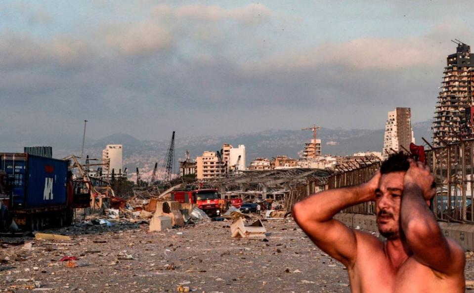 A man reacts at the scene of an explosion at the port in Lebanon's capital Beirut on August 4, 2020