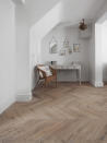 <p> There&apos;s no need to shy away from wood flooring in the bedroom. This salvaged oak from&#xA0;The Reclaimed Flooring Company has been sourced from historic buildings across France, Central and Eastern Europe. Laying it in this classic chevron style gives subtle movement and a sense of grandeur to the simple room scheme.&#xA0; </p> <p> It&apos;s also easy to see the beautiful flecks and characterful knots running through this light-colored timber, which is suitable for underfloor heating. </p>