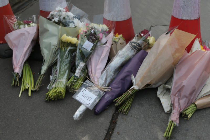 A small flower tribute with the message "Why" is started March 23, 2017, on Westminster Bridge one day after a terrorist attack on the Houses of Parliament where six people died and 50 people injured in London. File Photo by Hugo Philpott/UPI