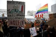 People take part in a protest against the ruling by Poland's Constitutional Tribunal that imposes a near-total ban on abortion in Warsaw