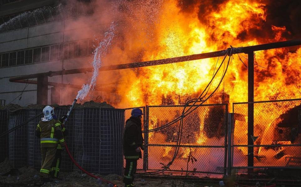 Members of emergency services respond to a fire after a Russian attack targeted energy infrastructure in Kyiv, Ukraine on October 18, 2022. Local authorities reported airstrikes in UkraineÃ¢s capital Kyiv on Tuesday morning, as a wave of drone and missile strikes on the countryÃ¢s capital and other cities continued its second week. At least 3 killed in the attacks. (Photo by Ukrainian State Emergency Service / Handout/Anadolu Agency via Getty Images) - Anadolu Agency via Getty Images