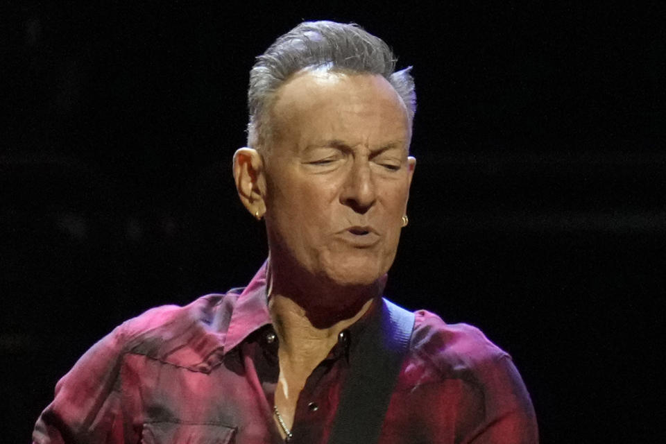 FILE - Bruce Springsteen plays his guitar on stage during his concert of Bruce Springsteen and The E Street Band World Tour 2024 performance, March 19, 2024, in Phoenix. The singer known for such hits as “Born to Run” and “Hungry Heart” sold his music catalog to Sony Music Group in late 2021 for an estimated $550 million, The New York Times reported. (AP Photo/Ross D. Franklin, File)