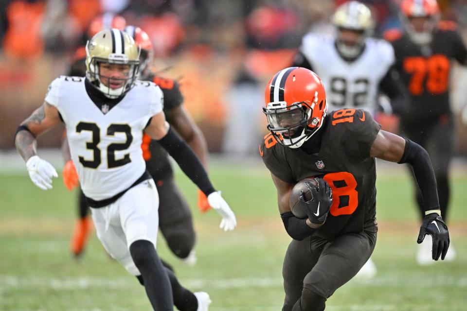 Cleveland Browns wide receiver David Bell (18) is chased by New Orleans Saints safety Tyrann Mathieu (32) during the second half on Dec. 24 in Cleveland. (AP Photo/David Richard)