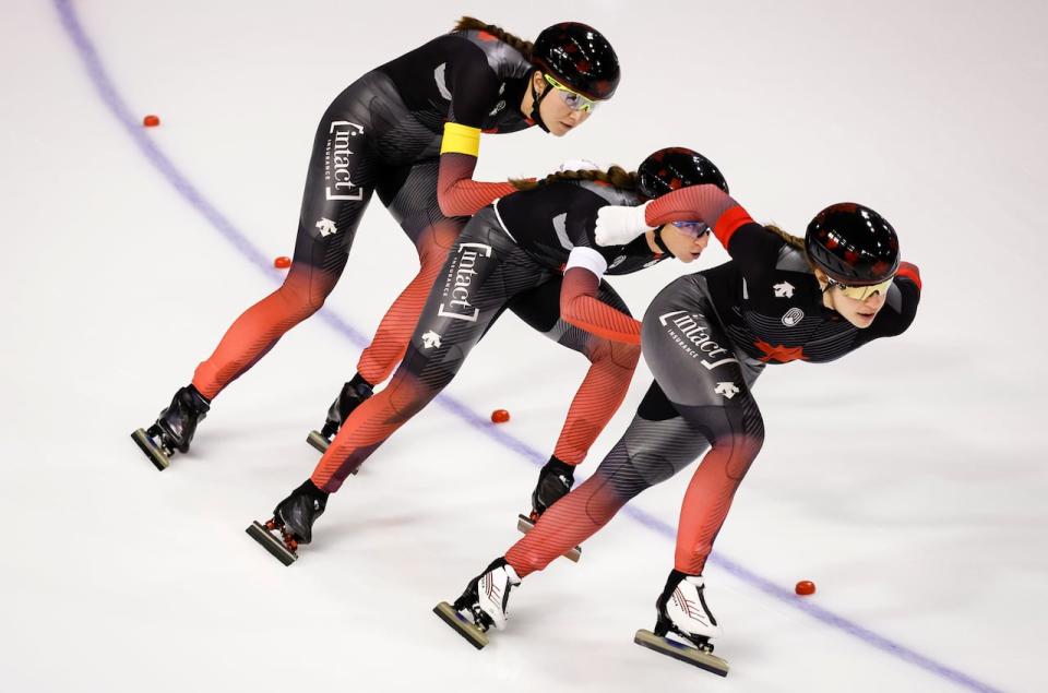 Canadians Isabelle Weidemann, left, Ivanie Blondin, centre, and Valérie Maltais won gold in the women's team pursuit event at the Four Continents speed skating championships on Sunday in Salt Lake City. (Jeff McIntosh/The Canadian Press/File - image credit)