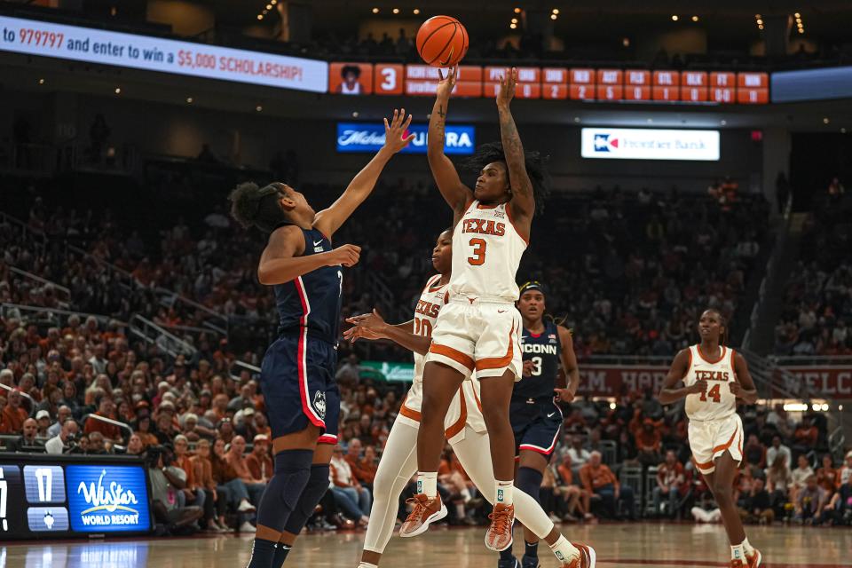 Texas guard Rori Harmon shoots over UConn's KK Arnold during the Longhorns' 80-68 win on Sunday, and AP voters moved Texas into the No. 5 spot in this week's Top 25 poll. The Big 12 has two top-10 teams along with No. 10 Baylor.