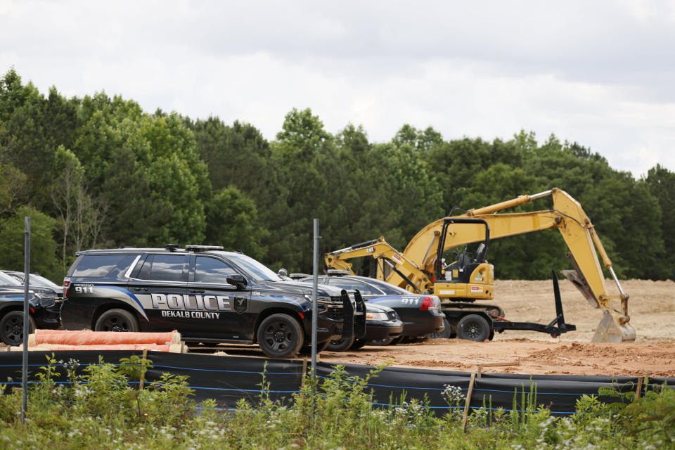 Atlanta Police Department cars are parked at one of the Atlanta Public Safety Training Center construction site entrances on Tuesday, May 30, 2023. Atlanta’s proposed police and fire training center will cost taxpayers more than double the previous estimate by Mayor Andre Dickens’ administration. (Miguel Martinez/Atlanta Journal-Constitution via AP)