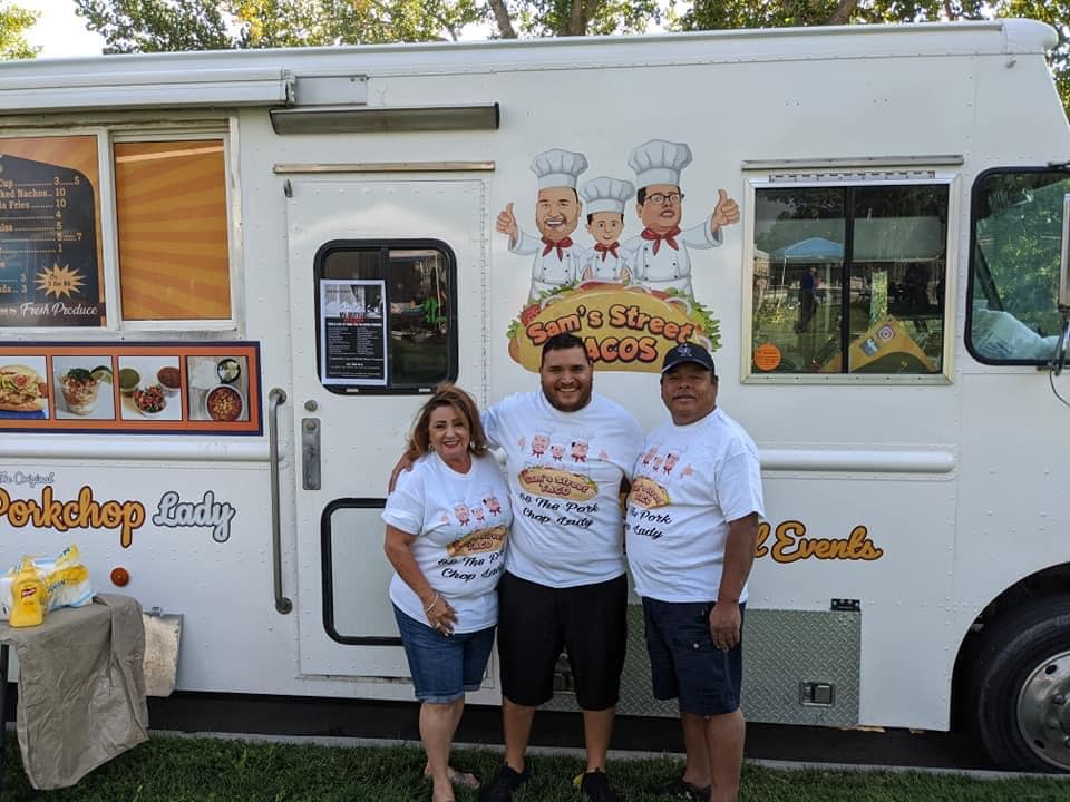 The Porkchop Lady/Sam's Street Tacos owners Marylou Hernandez, Sam Hernandez Jr., and Sam Hernandez Sr., in front of their popular food truck.