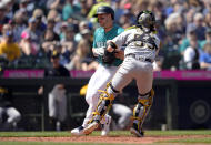 Pittsburgh Pirates catcher Jason Delay tags Seattle Mariners' Jarred Kelenic out at home after Cal Raleigh grounded into a fielder's choice during the fifth inning of a baseball game Saturday, May 27, 2023, in Seattle. (AP Photo/Lindsey Wasson)