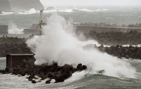 Waves crash as Typhoon Vongfong approaches Japan's main islands in Kuroshio Town, Kochi prefecture, in this photo taken by Kyodo October 12, 2014. REUTERS/Kyodo