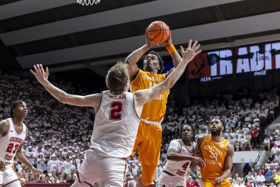 Tennessee forward Tobe Awaka (11) shoots over Alabama forward Grant Nelson (2) during the first half of an NCAA college basketball game, Saturday, March 2, 2024, in Tuscaloosa, Ala. (AP Photo/Vasha Hunt)