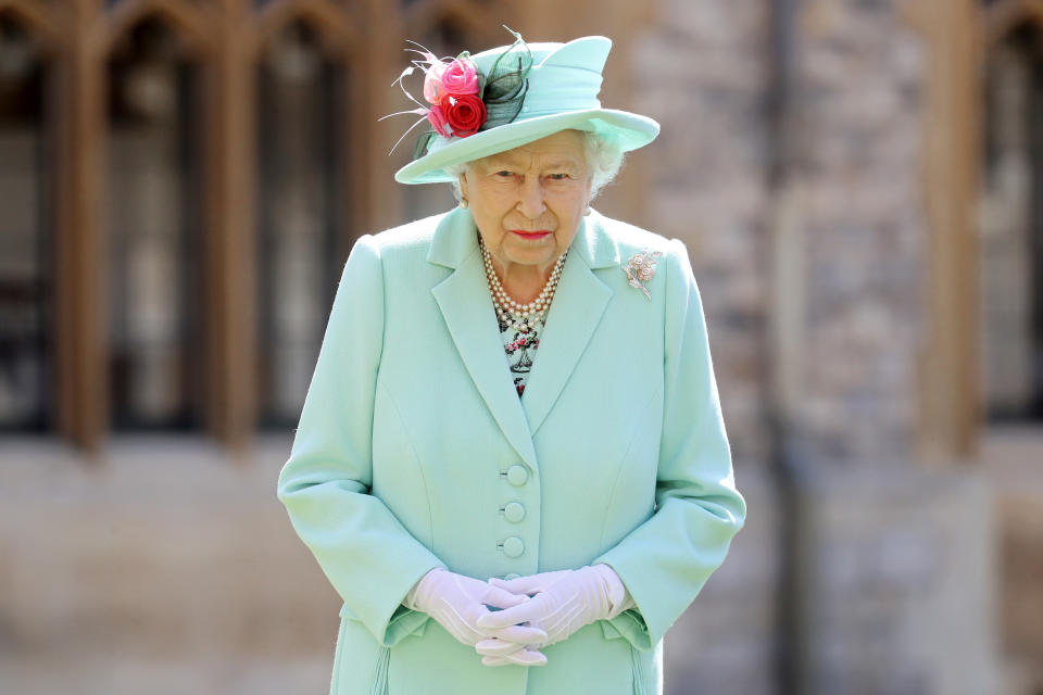 WINDSOR, ENGLAND - JULY 17: Queen Elizabeth II poses after awarding Captain Sir Thomas Moore with the insignia of Knight Bachelor at Windsor Castle on July 17, 2020 in Windsor, England. British World War II veteran Captain Tom Moore raised over £32 million for the NHS during the coronavirus pandemic.  (Photo by Chris Jackson/Getty Images)