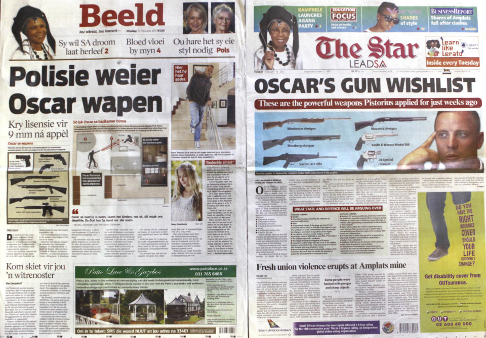 FILE - Two newspapers headline the news of Olympian Athlete Oscar Pistorius' applications for licensing of six firearms a few weeks before he shot and killed his girlfriend Reeva Steenkamp, on Wednesday Feb. 20, 2013. Pistorius shot his girlfriend Reeva Steenkamp more than a decade ago in a Valentine's Day killing that jolted the world and shattered the image of the sports superstar.(AP Photo/Denis Farrell, File)