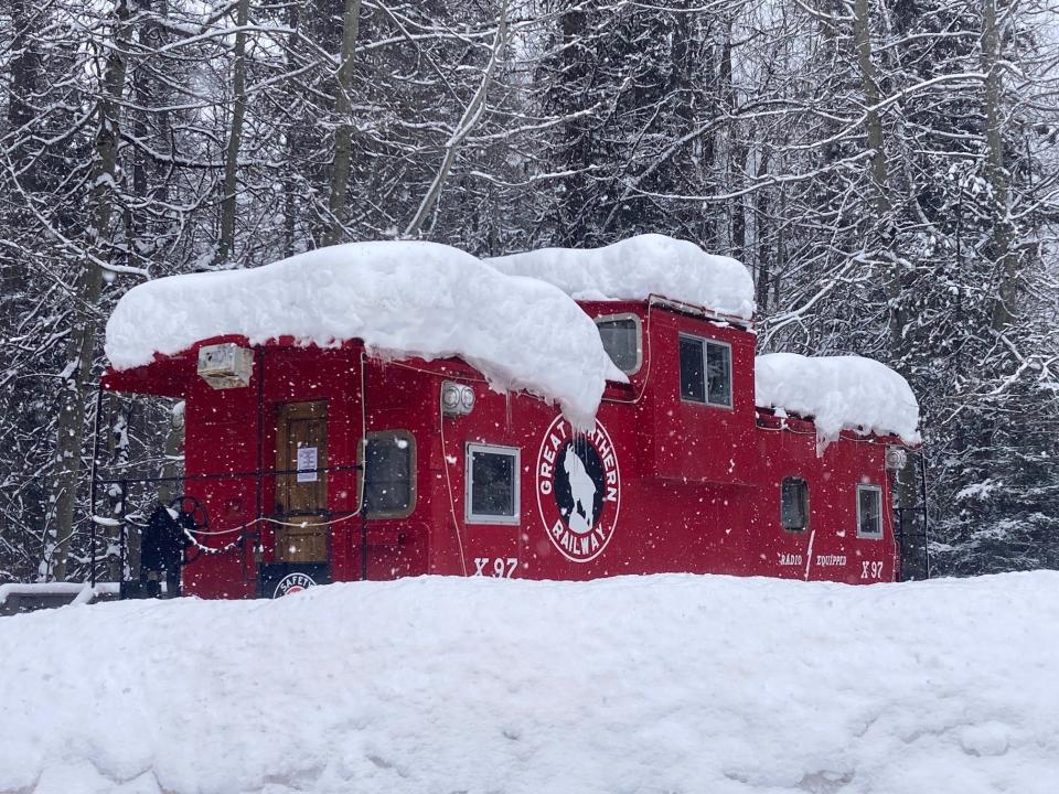 Great Northern Railway caboose houses overnight guests at Izzak Walton Lodge.