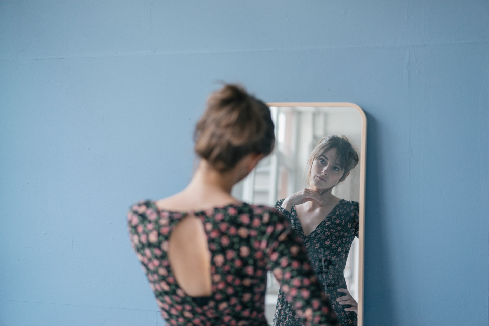 Woman looking in the mirror