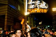 Tsai Ing-wen supporters celebrate her victory and chant slogans in support of pro-democracy protesters in Hong Kong outside the Democratic Progressive Party's headquarters in Taipei