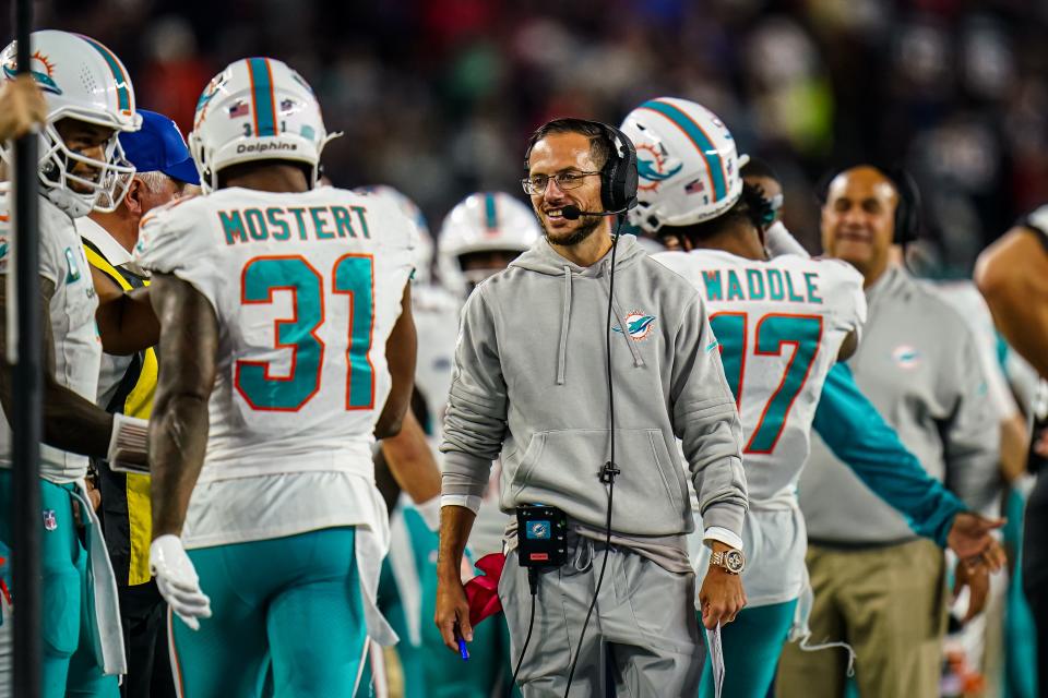 Dolphins coach Mike McDaniel reacts to one of Raheem Mostert's two touchdown runs against the Patriots.