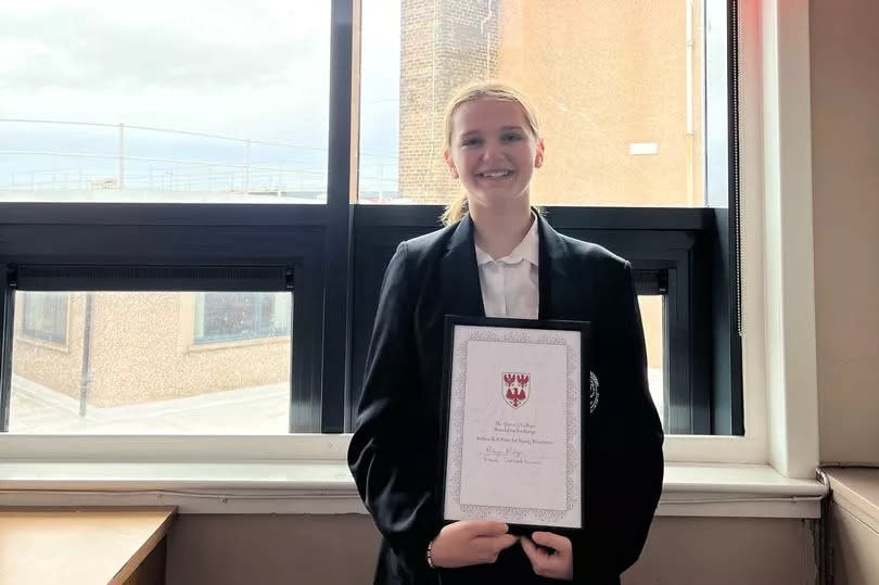 Robyn Rodgers with her award from Oxford University