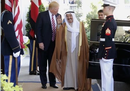 U.S. President Donald Trump (L) welcomes Emir of Kuwait Sabah Al-Ahmad Al-Jaber Al-Sabah (C) at the White House in Washington, U.S., September 7, 2017. REUTERS/Jonathan Ernst
