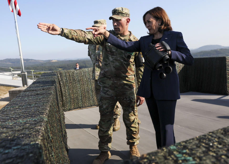 U.S. Vice President Kamala Harris, right, uses binoculars at the military observation post as she visits the demilitarized zone (DMZ) separating the two Koreas, in Panmunjom, South Korea Thursday, Sept. 29, 2022. (Leah Millis/Pool Photo via AP)