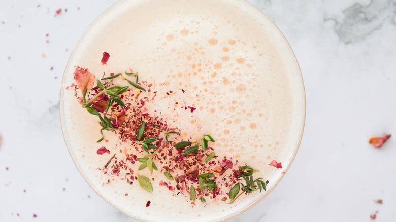 Overhead view of thyme and rose petal garnish