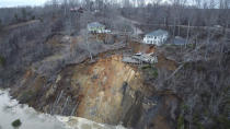 This drone photo provided by Hardin County Fire Department, Savannah, Tenn. on Feb. 15, 2030, shows the landslide on Chalk bluff on the Tennessee River. Authorities say two homes were destroyed when a hillside collapsed near a swollen river in western Tennessee. News outlets report no one was injured in the slide, which occurred along the Tennessee River near the Hardin County community of Savannah.(Melvin Martin /Hardin County Fire Department, Savannah, Tenn. via AP)