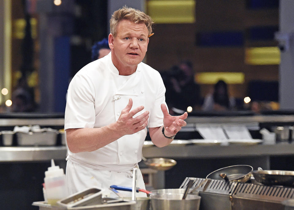 He's in the kitchen with a strained expression